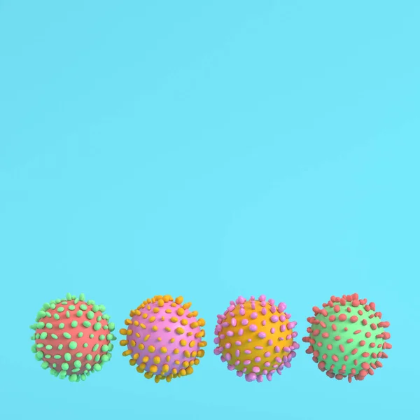 Pastel renklerde parlak mavi arkaplanda dört renkli virüs