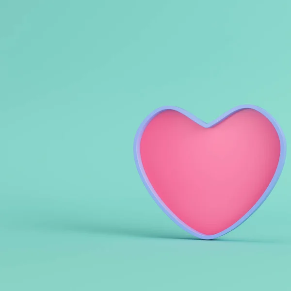 Corazón rosa con marco azul sobre fondo verde brillante en pastel — Foto de Stock