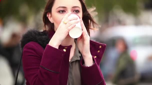 Beautiful woman holding a cup of tea — Stock Video