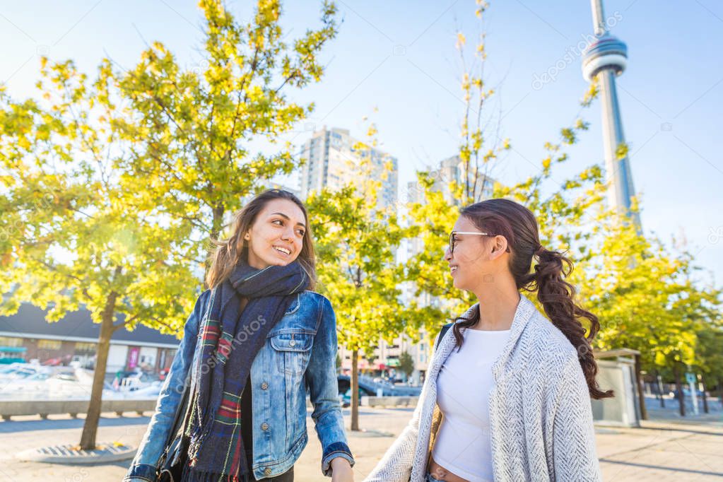 Best friends walking together in Toronto