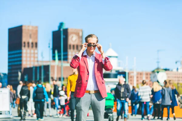 Fashion young man in Oslo lowering sunglasses — Stock Photo, Image