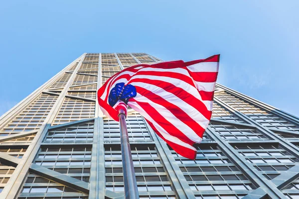 American flag with modern skyscraper on background — Stock Photo, Image