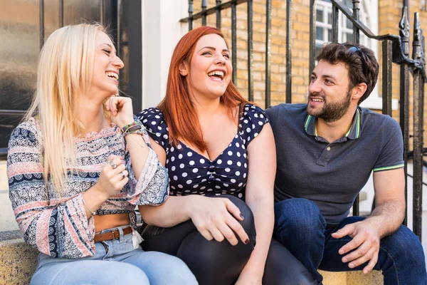 Group of friends talking and laughing together — Stock Photo, Image
