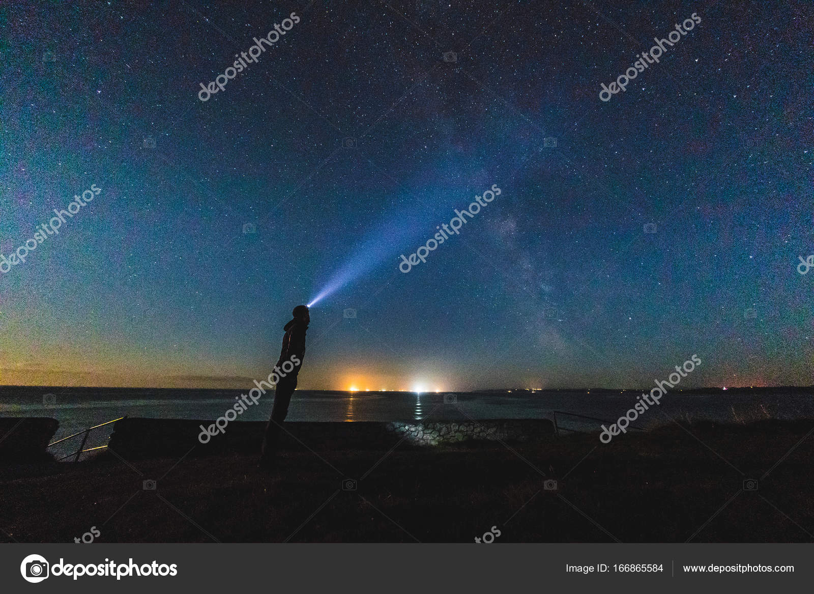 Man with headlight staring at night sky — Stock Photo © william87