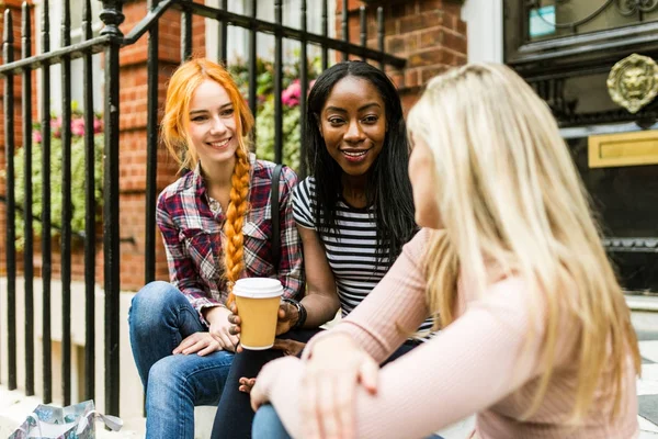 Women, friends, chatting and smiling in London — Stock Photo, Image