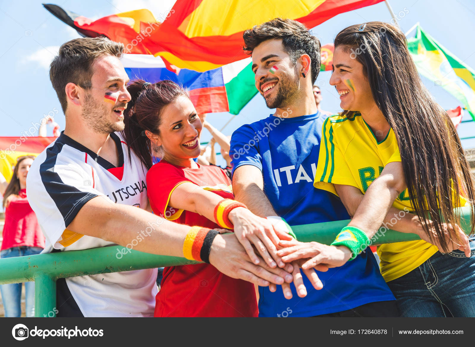 Happy fans supporters from different countries together at stadi
