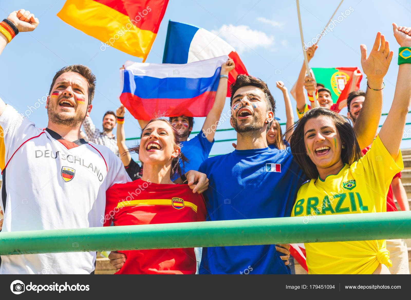 Happy fans supporters from different countries together at stadi Stock
