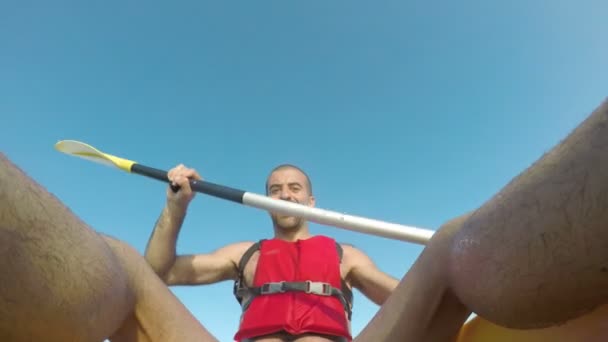 Man paddling on a kayak at sea in Spain — Stock Video