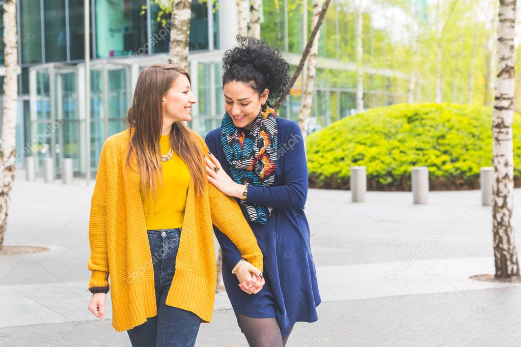 Lesbian couple in Berlin walking and holding hands