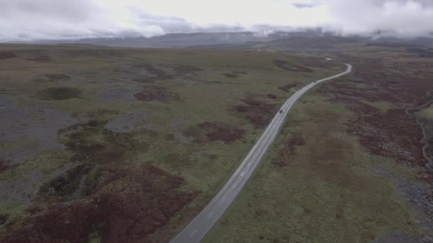 Aerial view of countryside road in Wales on a cloudy day — Stock Video