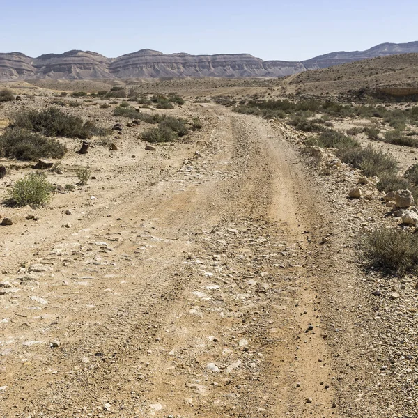 Dusty mountains and deep craters. — Stock Photo, Image