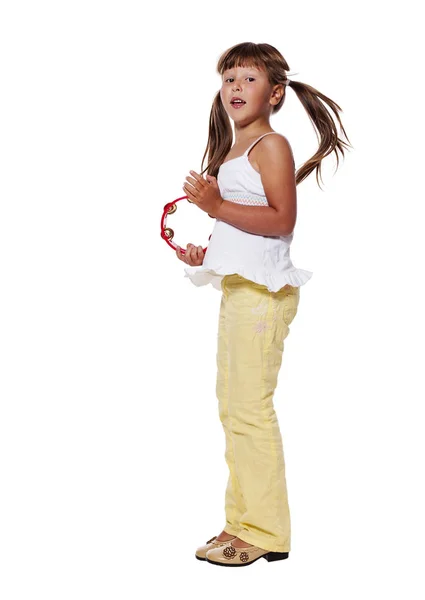 Mädchen spielt Tamburin — Stockfoto
