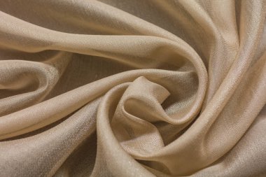 Bej renkli tekstil ile parlak kumaş arkaplan
