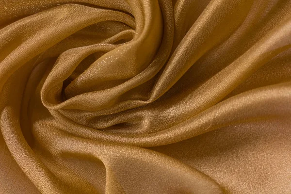 Shiny cloth background with beige vial textile