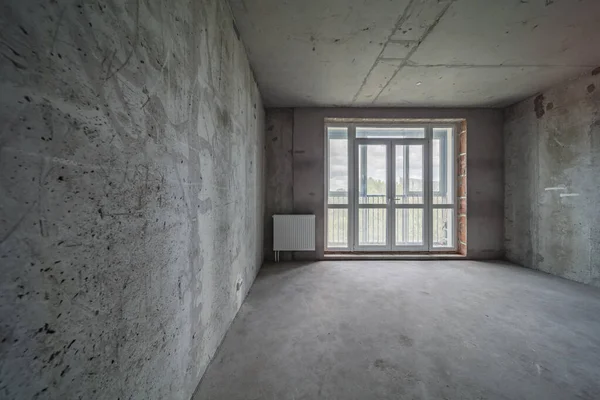 construction site of residential apartment renovation. empty room before reimbursement new concrete interior