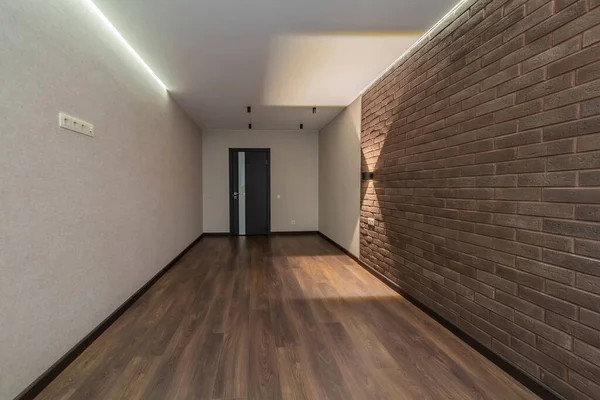 empty room arter repair modern clean interior with bricks and laminate house for sale
