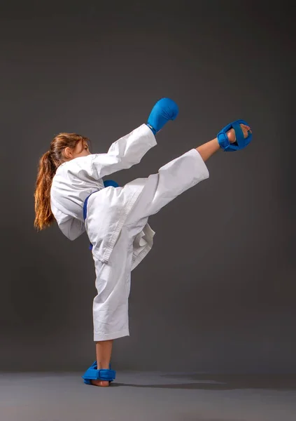 Little Girl White Kimono Blue Belt Equipment Carries Out Blows — Stock Photo, Image