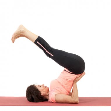 Yoga yaparken güzel Olgun kadın