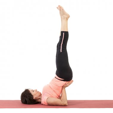 Yoga yaparken güzel Olgun kadın