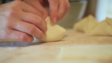 Preparation of converter with dough filling with hands.