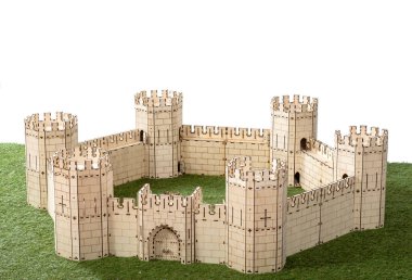 A little model of a plywood castle on an isolated background.