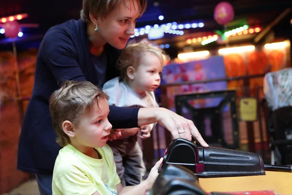 Mother with sons at amusement park — Stock Photo, Image