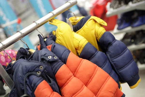 Winter jackets on hangers — Stock Photo, Image