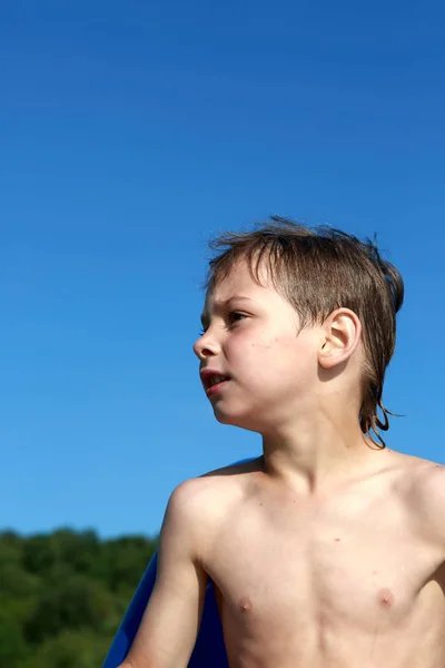 Boy on sky background — Stock Photo, Image