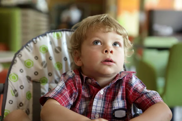 Kid in highchair — Stock Photo, Image