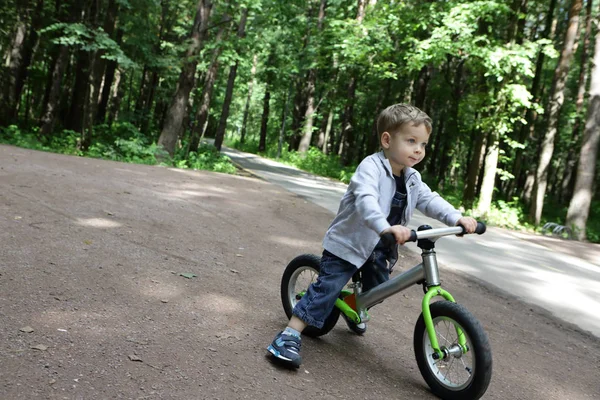 Boy on balance bike