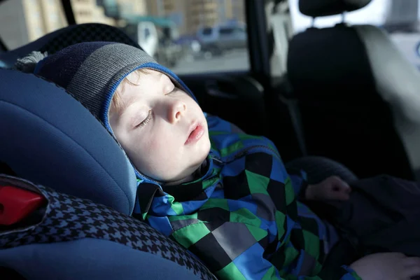 Child sleeping in car seat — Stock Photo, Image