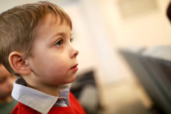 Serious child watching performance — Stock Photo, Image