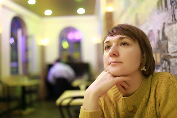 Thinking woman in cafe — Stock Photo, Image