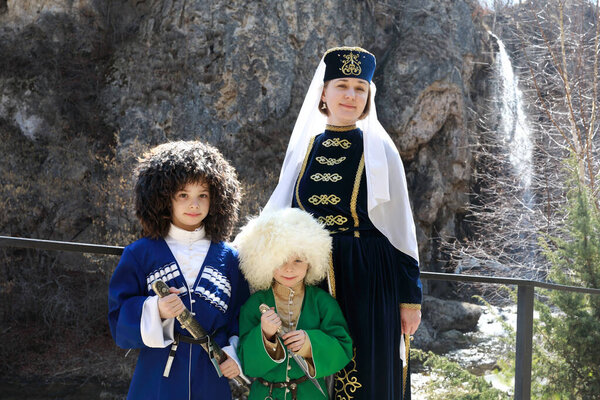 Mother and her two sons posing in Karachai clothes, Kislovodsk, Russia