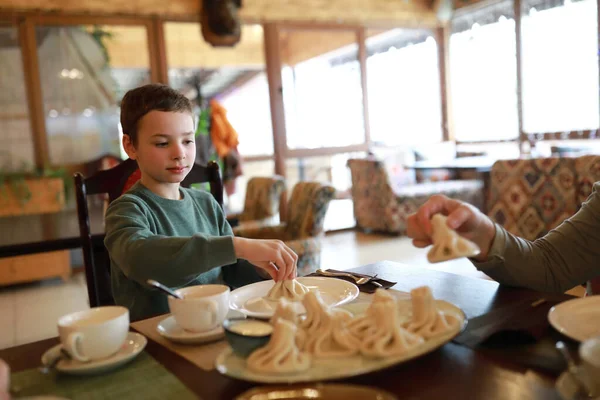 Child Eating Khinkali Georgian Restaurant — Stock Photo, Image