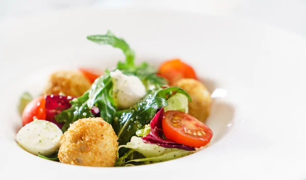 Salad with fried mozzarella balls — Stock Photo, Image