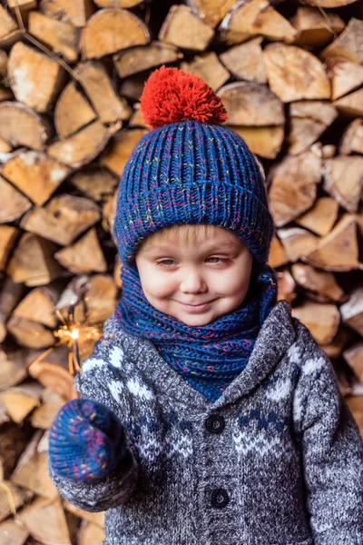 Boy holding sparkler — Stock Photo, Image