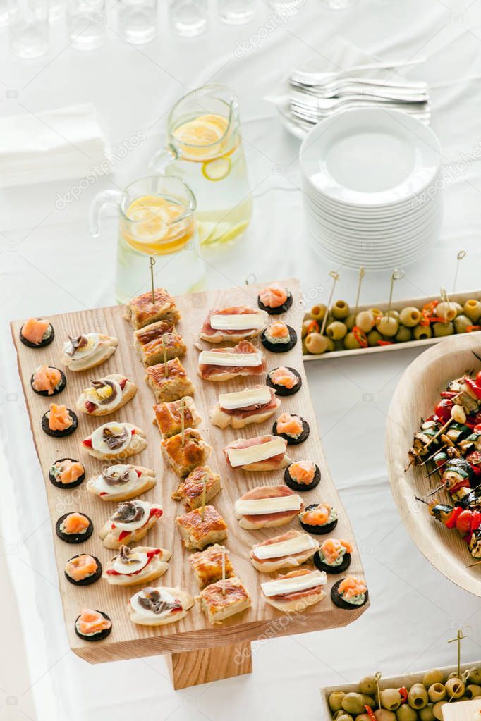 Snacks on catering table Stock Photo by ©Shebeko 130434256