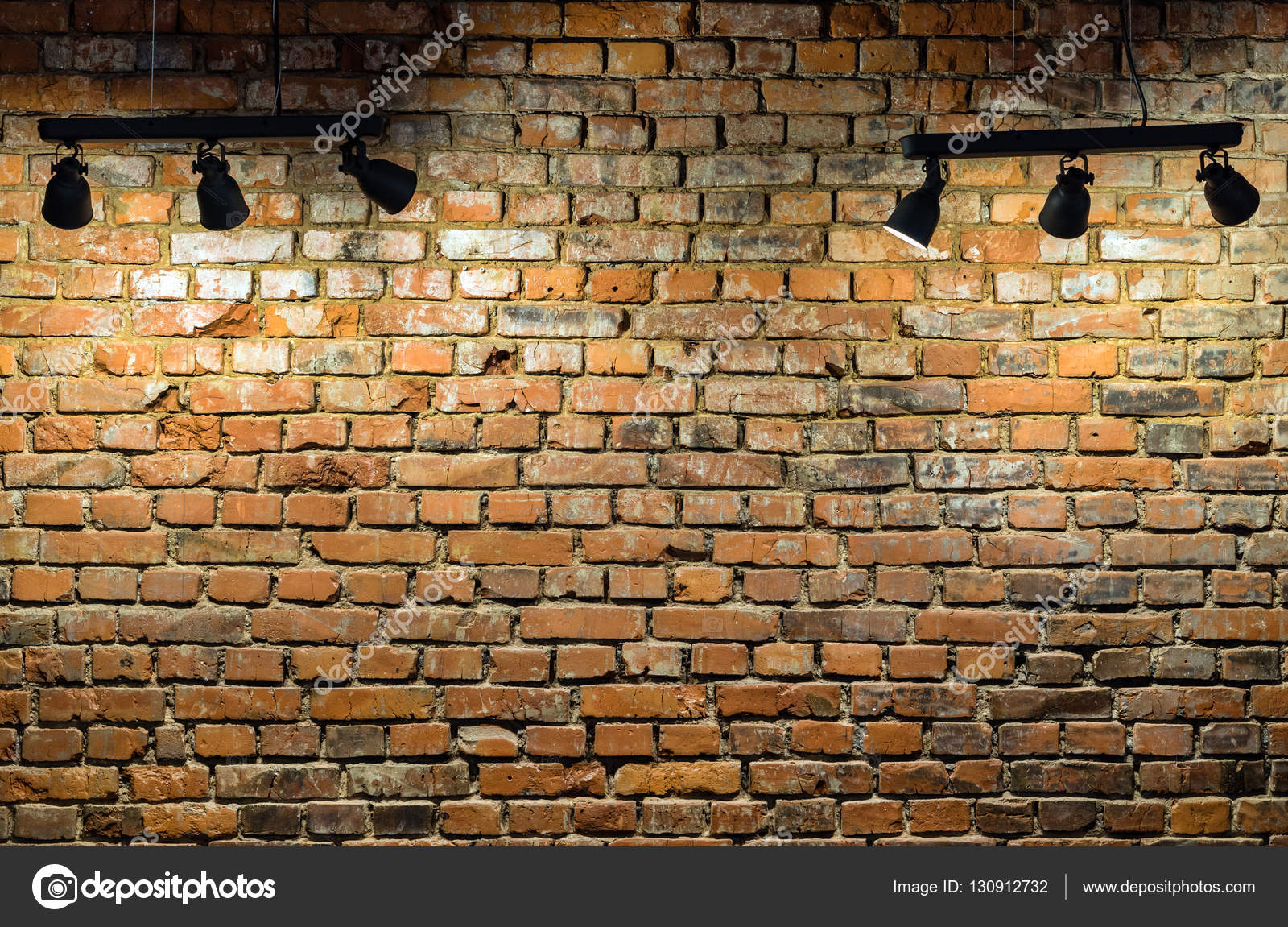 Brick wall with light Photo
