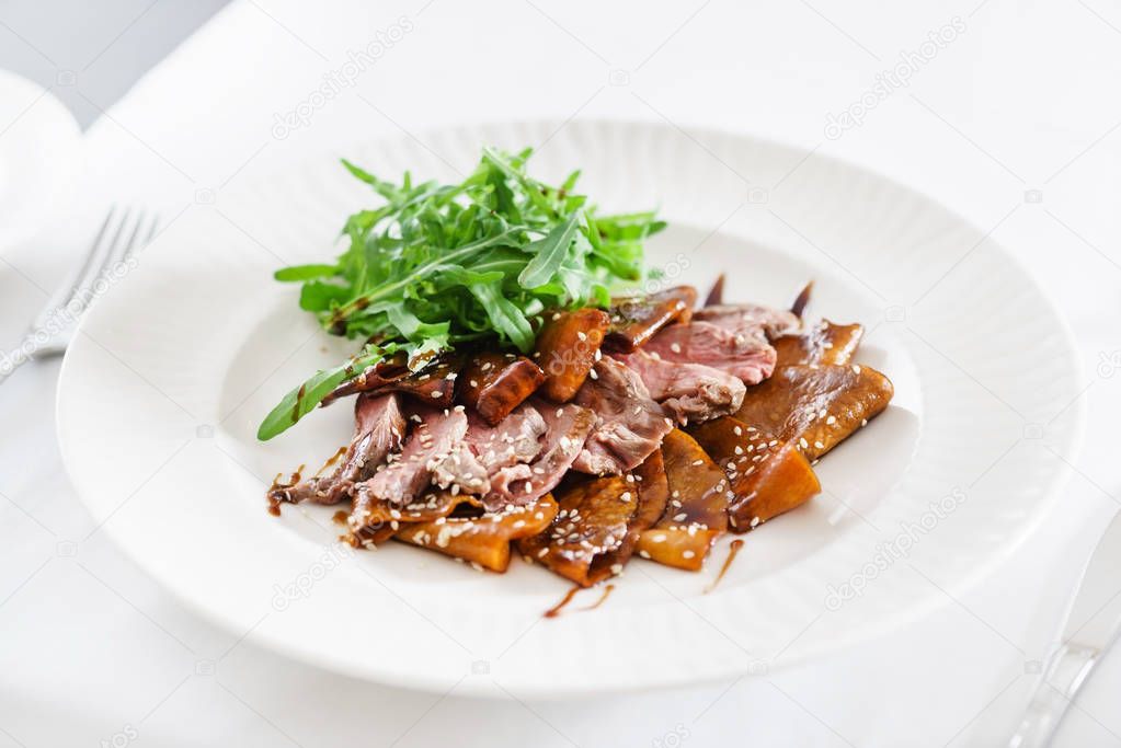 beef slices on white plate