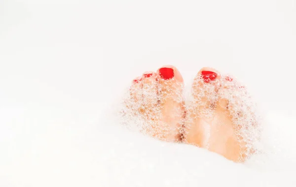 Feet with red nails — Stock Photo, Image