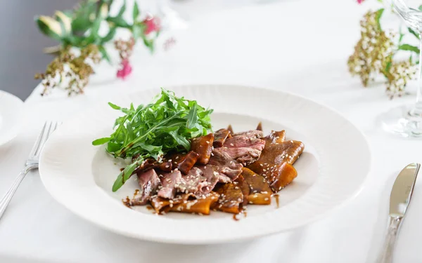 Beef slices on white plate — Stock Photo, Image