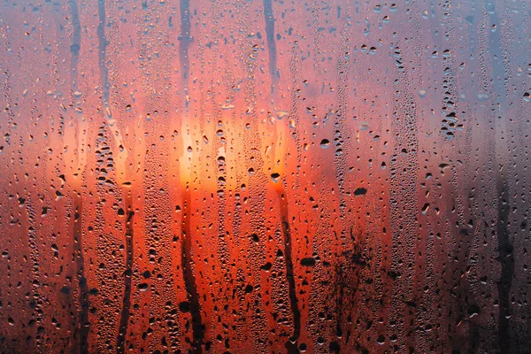Zachód słońca krople na okno — Zdjęcie stockowe