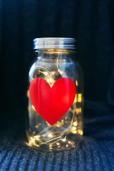Jar with heart and lights — Stock Photo, Image