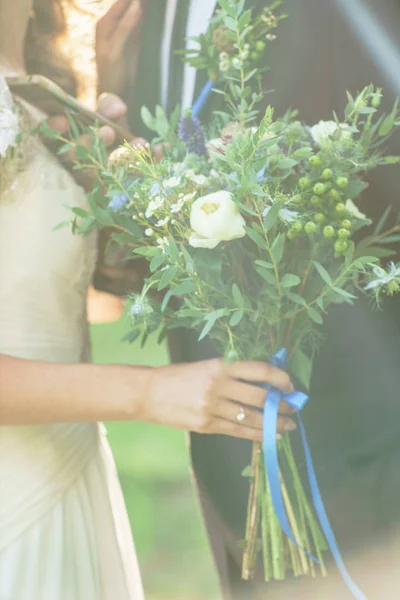 Bride with wedding flowers — Stock Photo, Image