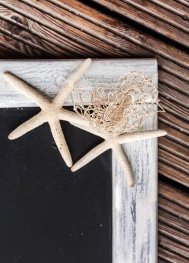 Deniz yıldızı ile boş yazı tahtası