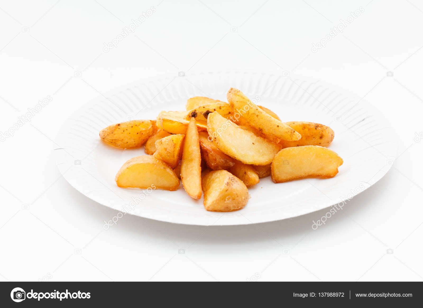 Roasted potatoes on plate — Stock Photo © Shebeko 137988972