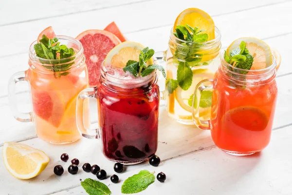 Fruit summer drinks in glasses — Stock Photo, Image