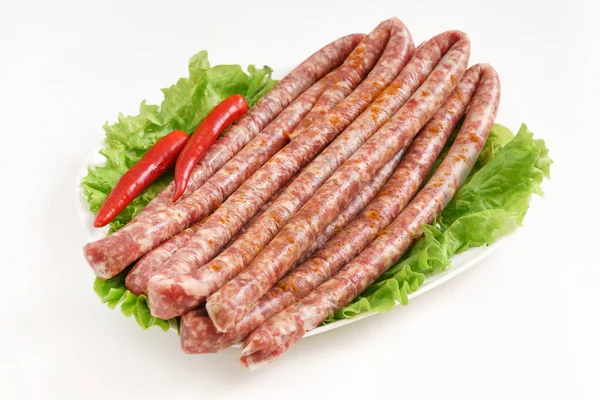 Raw sausages on white — Stock Photo, Image