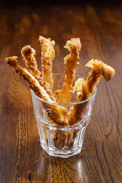 Breadsticks with cheese in glass — Stock Photo, Image